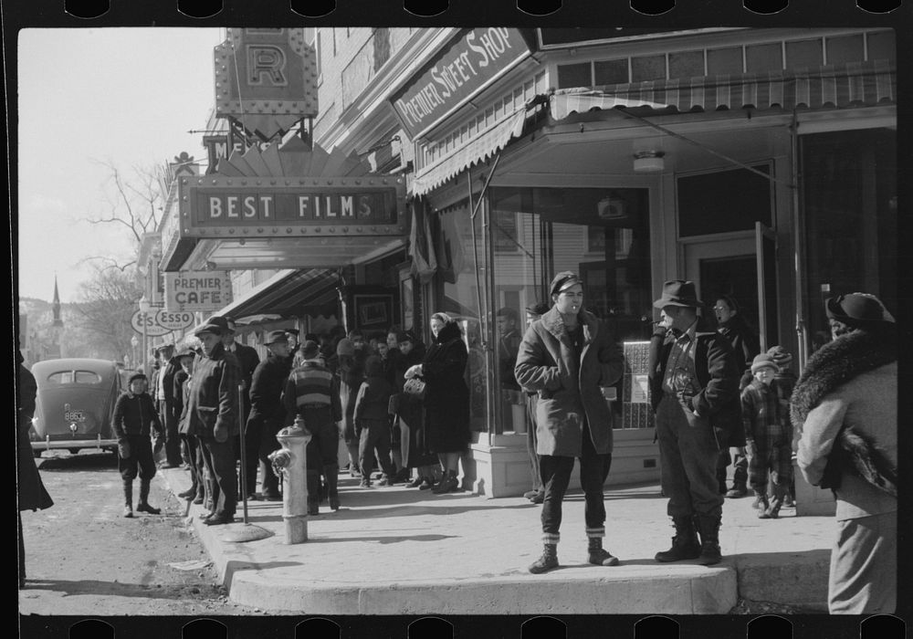 [Untitled photo, possibly related to: Children and farmers waiting to go into movie on Saturday afternoon. Littleton, New…