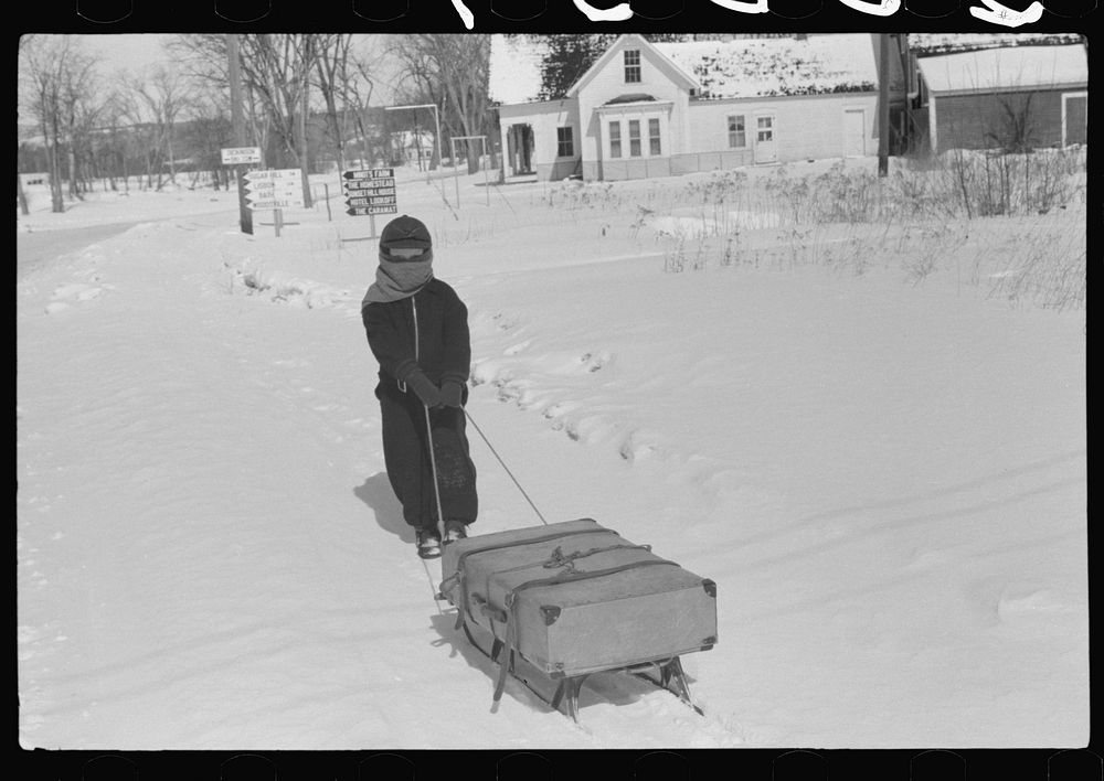 [Untitled photo, possibly related to: Child bringing home suitcase on sled, Franconia, New Hampshire] by Marion Post Wolcott