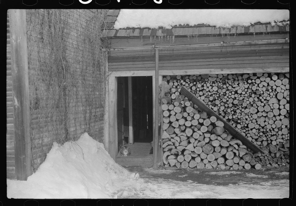 Woodshed on Putney Homestead farm near Woodstock, Vermont. Sourced from the Library of Congress.