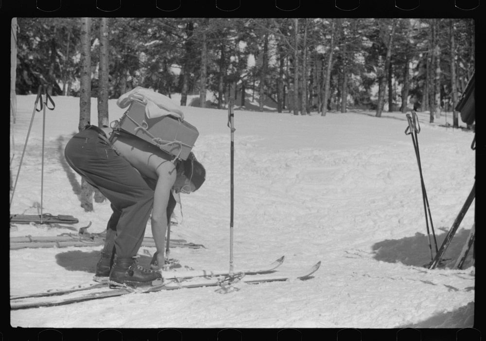 Forest ranger bringing in supplies which he has carried up the mountain on skiis to his hut which is also used by skiers in…