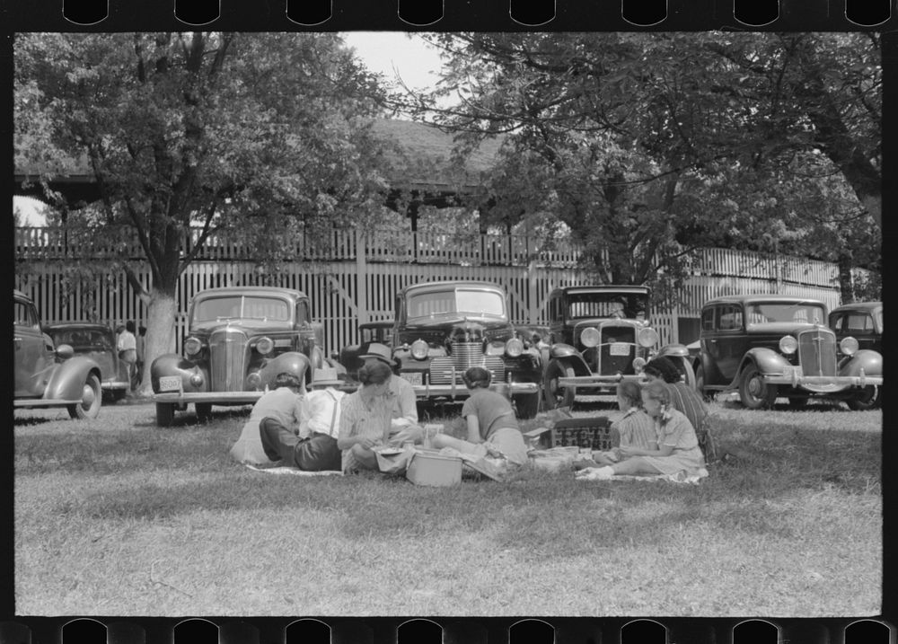 [Untitled photo, possibly related to: People at the Shelby County Horse Show and Fair eating a picnic lunch, Shelbyville…