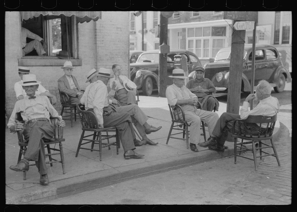 [Untitled photo, possibly related to: Farmers exchange news and greetings in front of courthouse on Saturday afternoon.…