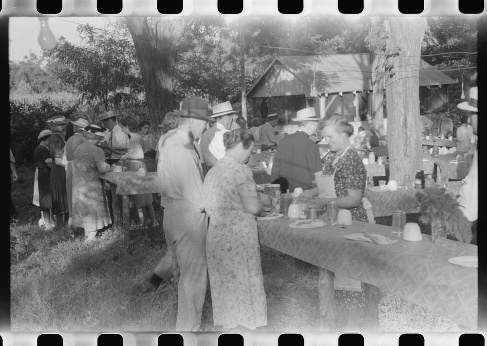 [Untitled photo, possibly related to: Priest talking to one of the parishioners before a church supper. Near Bardstown…