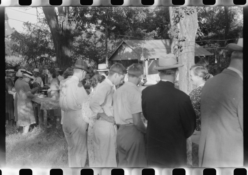 [Untitled photo, possibly related to: Priest talking to one of the parishioners before a church supper. Near Bardstown…