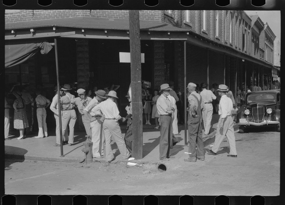 Farmers in front of store on Saturday afternoon in Cave City [actually Horse Cave], Kentucky. Sourced from the Library of…