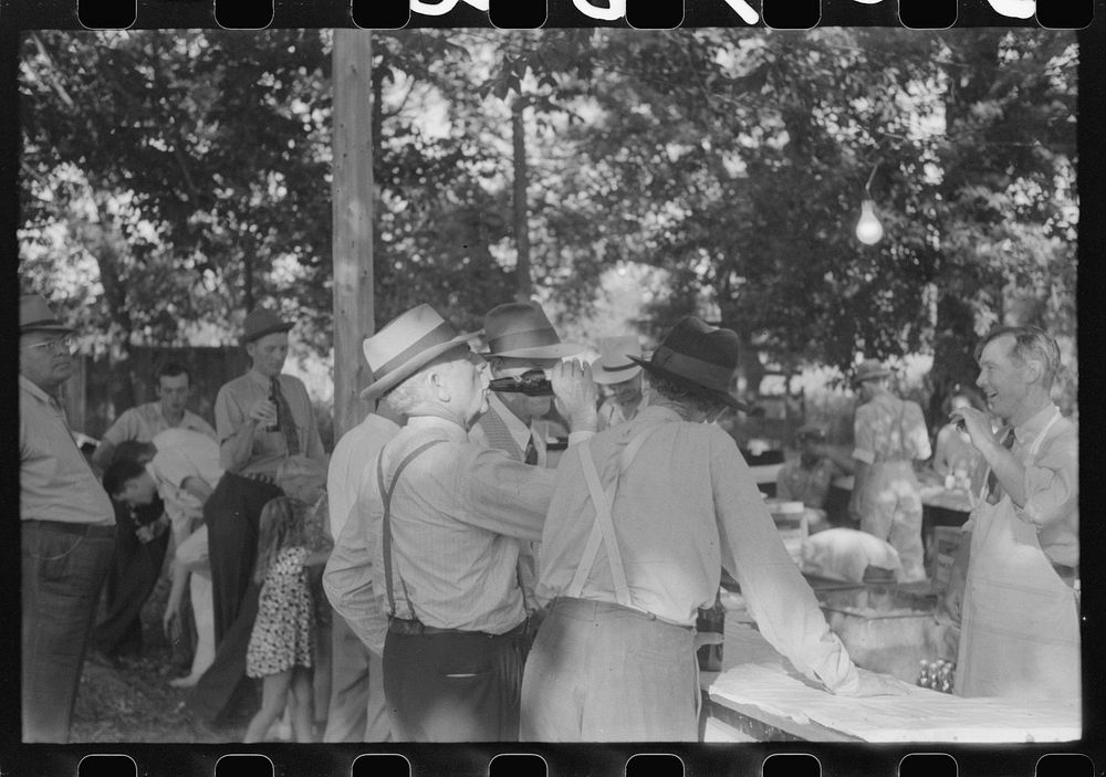 [Untitled photo, possibly related to: "Ball-throwing game" on the grounds of St. Thomas Church at a benefit picnic supper.…