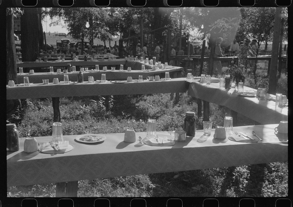Table in picnic grove set for St. Thomas church supper near Bardstown, Kentucky. Sourced from the Library of Congress.