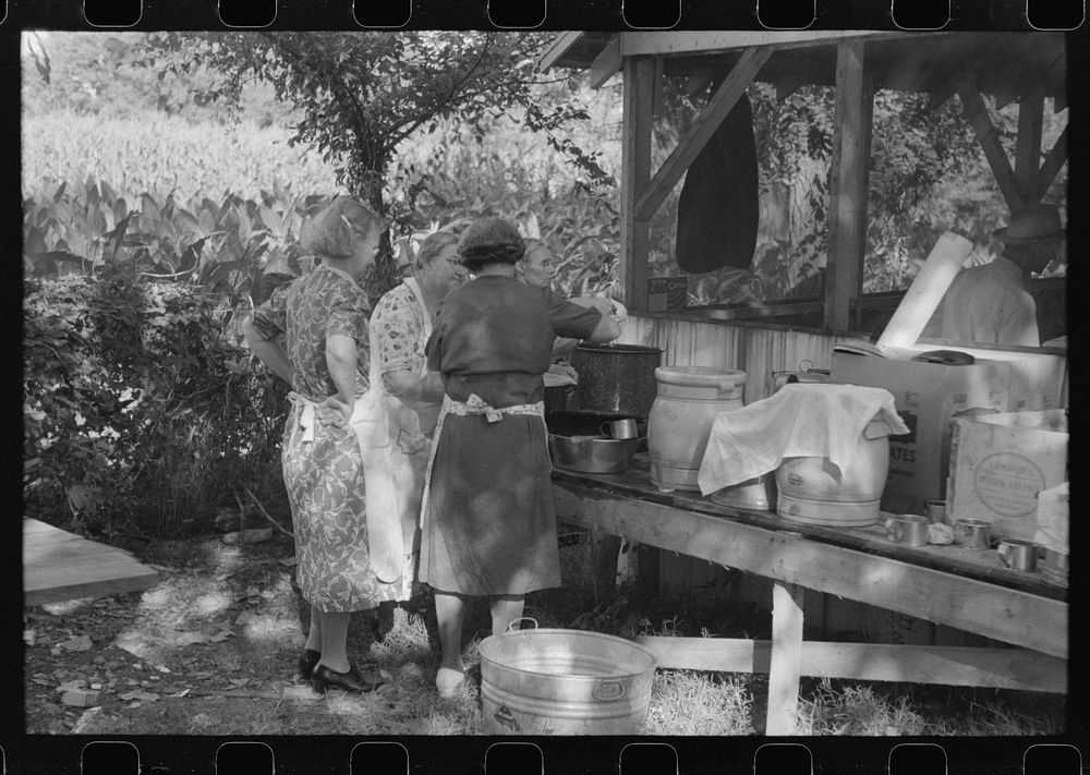 [Untitled photo, possibly related to: Parishoners preparing food for a benefit picnic supper on the grounds of St. Thomas…