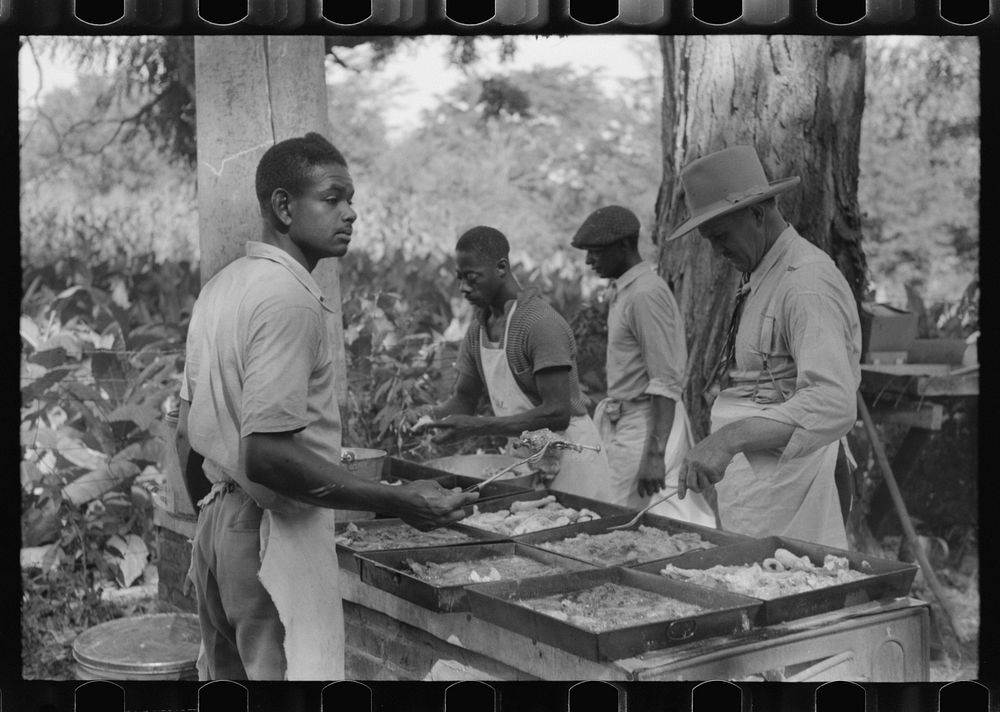 Cooking fried supper for a benefit picnic supper on the grounds of St. Thomas' Church. Near Bardstown, Kentucky. Sourced…