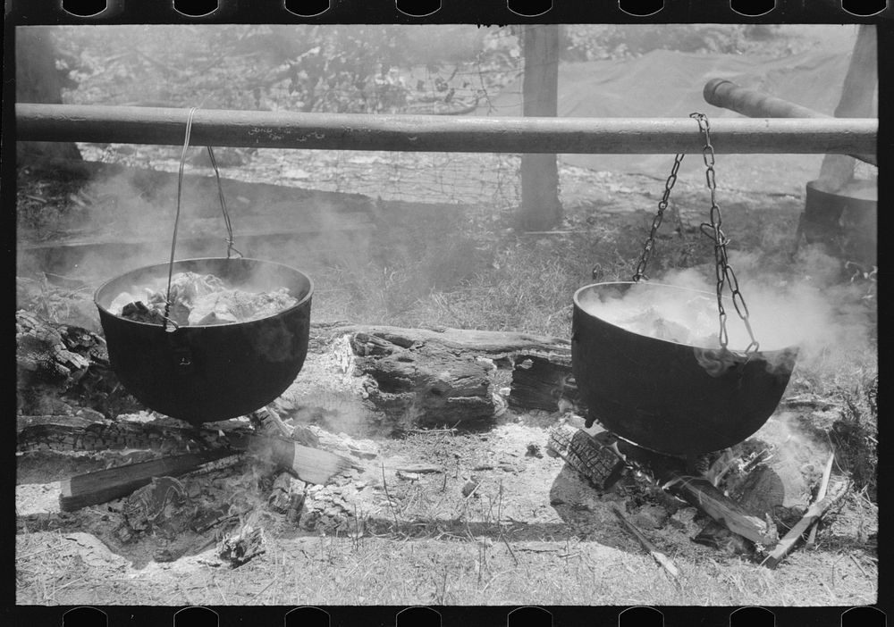 Barbecuing beef and lamb for a benefit picnic supper on the grounds of St. Thomas' Church. Near Bardstown, Kentucky. Sourced…