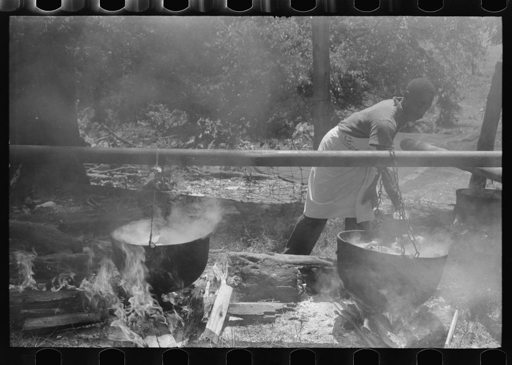 Barbecueing beef and lamb for a benefit picnic supper on the grounds of St. Thomas' Church. Near Bardstown, Kentucky.…