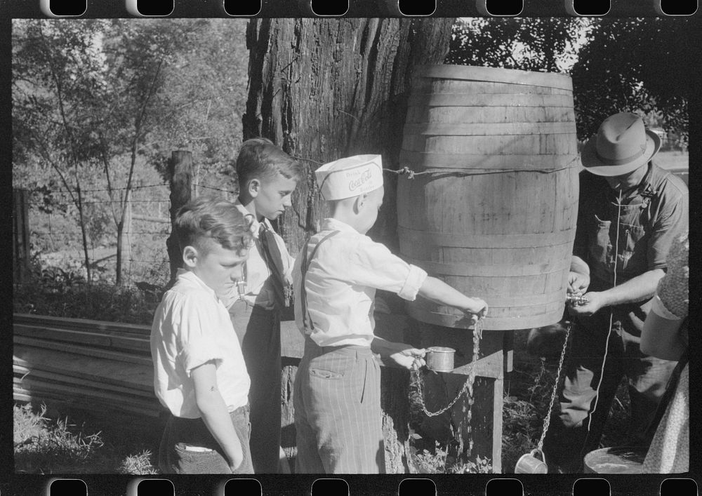 Children getting a drink of water at church picnic at St. Thomas Church, near Bardstown, Kentucky. Sourced from the Library…