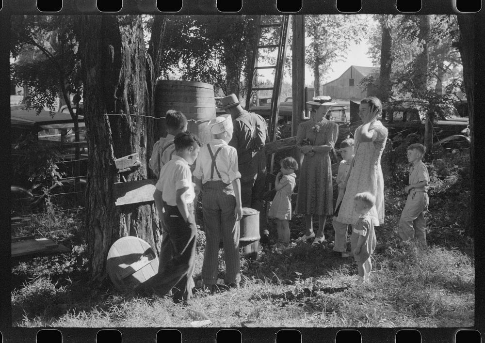 [Untitled photo, possibly related to: Children getting a drink of water at church picnic at St. Thomas Church, near…