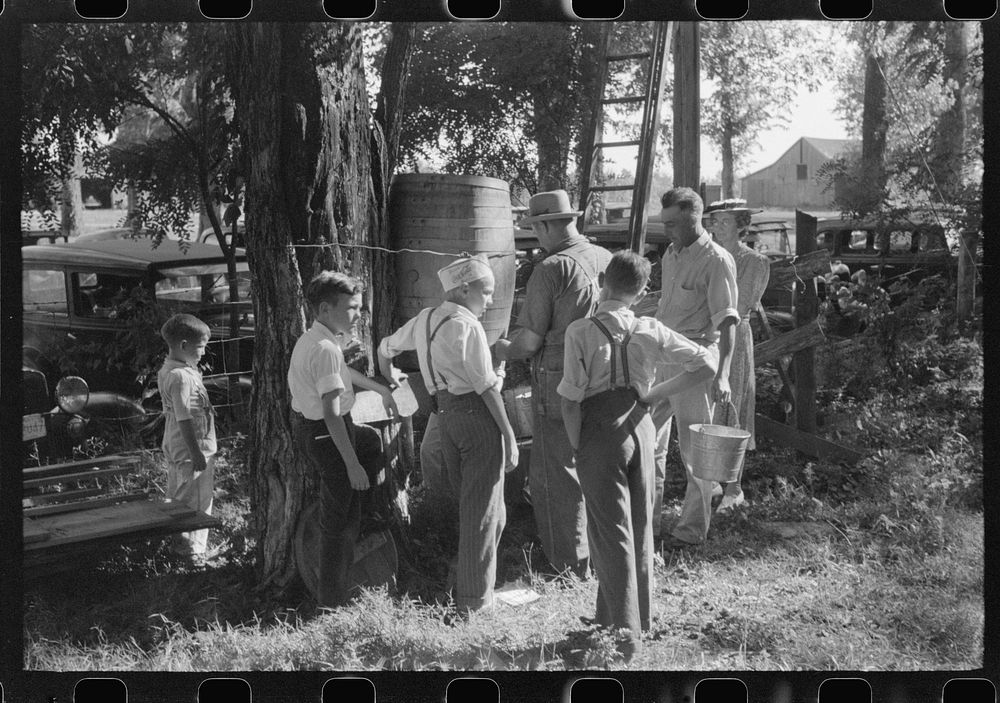 [Untitled photo, possibly related to: Children getting a drink of water at church picnic at St. Thomas Church, near…