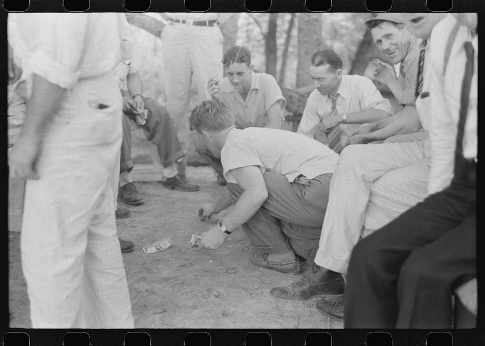Shooting craps at American Legion fish fry, Oldham County, Post 39, near Louisville, Kentucky. Sourced from the Library of…