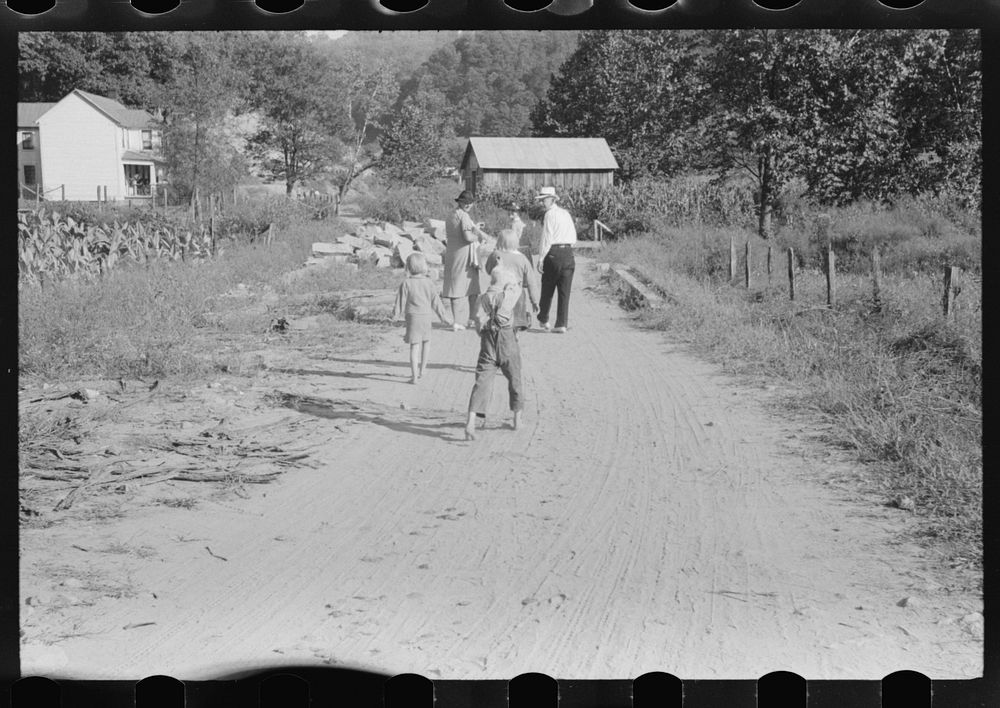 [Untitled photo, possibly related to: Friends of the deceased going home after a memorial meeting. Up Frozen Creek, near…