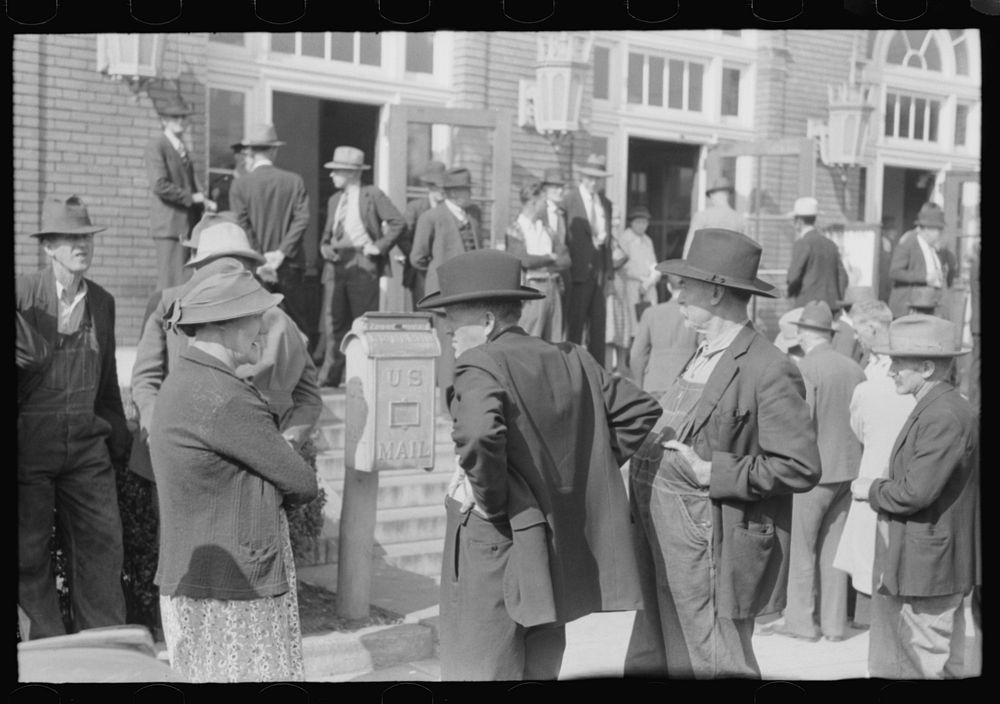 Mountain people exchanging greetings and news on court day in front of the federal building, Jackson, Breathitt County…