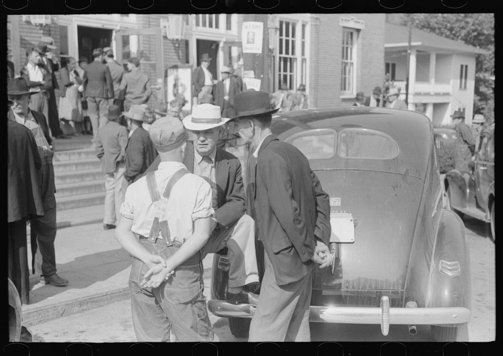 [Untitled photo, possibly related to: Mountain people exchanging greetings and news on court day in front of the federal…