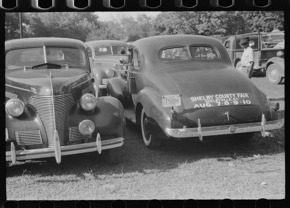 Cars parked in fairgrounds during county fair and horse show. Shelbyville, Kentucky. Sourced from the Library of Congress.