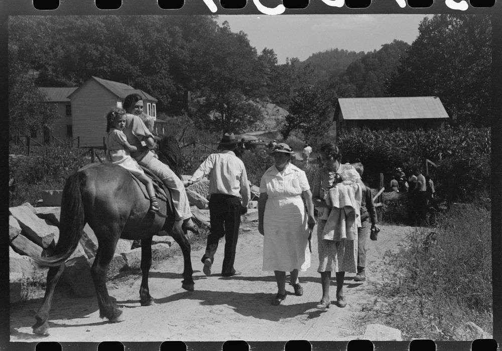 [Untitled photo, possibly related to: Relatives and friends of the family of the deceased going home from a memorial meeting…