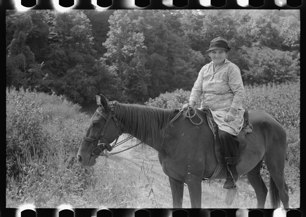 [Untitled photo, possibly related to: Mountain woman riding to town up Frozen Creek, near Jackson, Breathitt County…