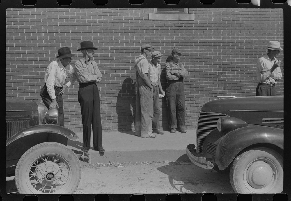 [Untitled photo, possibly related to: Farmer listening to itinerant salesman on court day, Campton, Kentucky]. Sourced from…