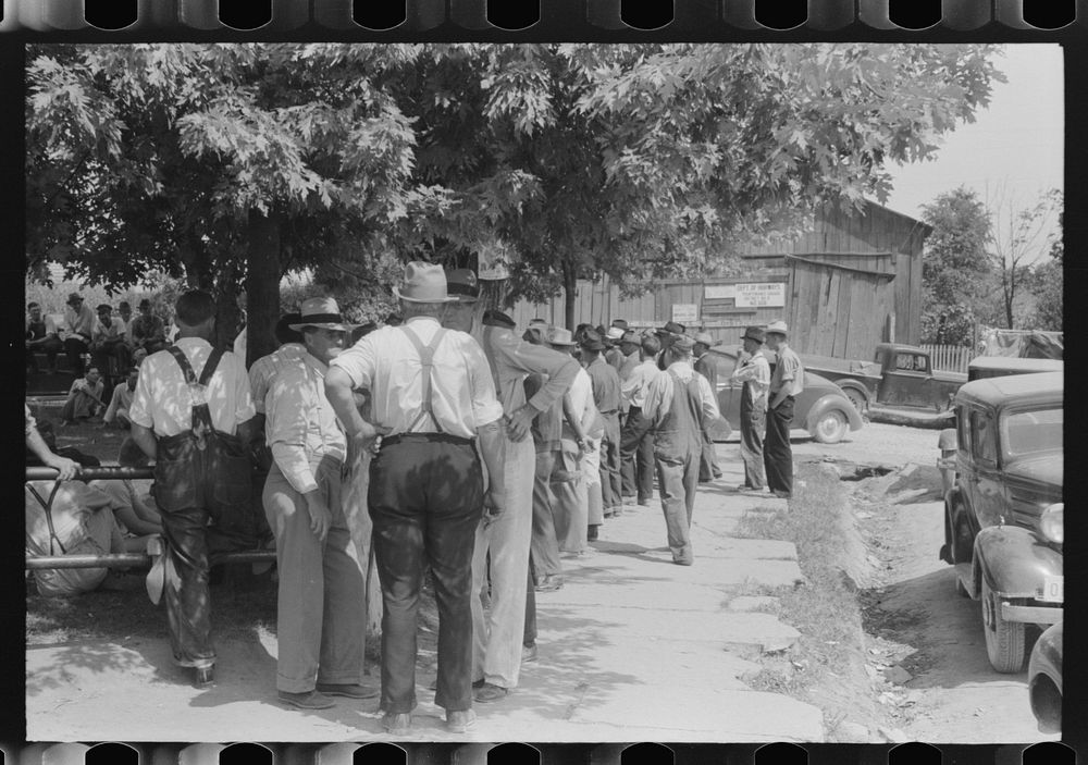 Mountaineers and farmers exchange news near courthouse on court day. Campton, Wolfe County, Kentucky. Sourced from the…