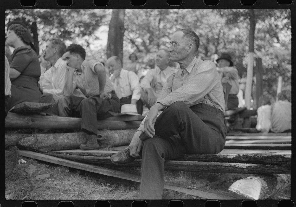 [Untitled photo, possibly related to: Friends and relatives of the deceased listening to the preacher at an annual memorial…
