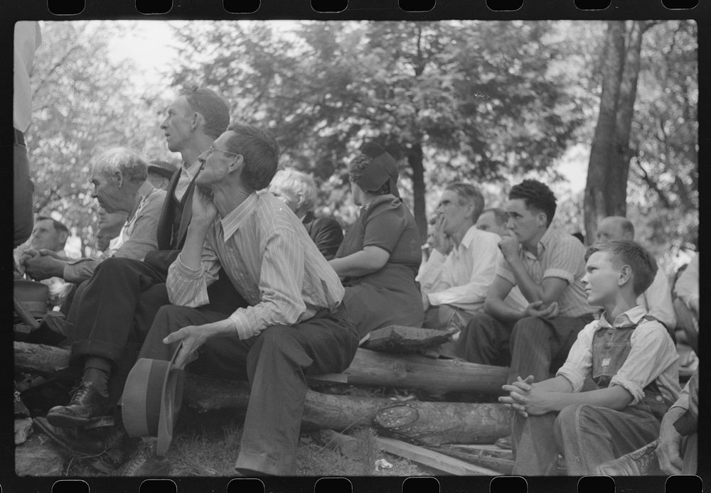 Friends of the deceased's family, at an annual memorial meeting in the family cemetery. In the mountains near Jackson…
