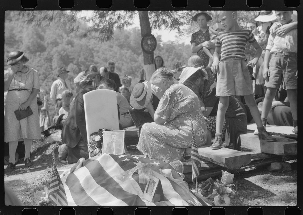 [Untitled photo, possibly related to: Mother and widow and relatives weeping at the grave of deceased at memorial meeting…