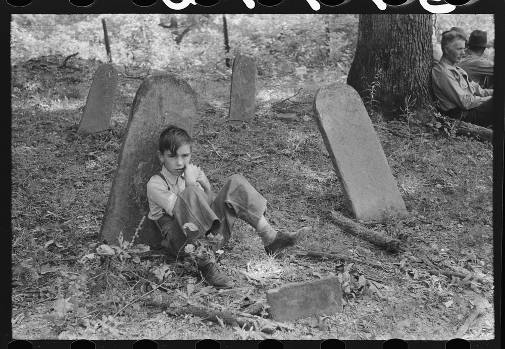 [Untitled photo, possibly related to: Son of one of the deceased's family at an annual memorial meeting in the family…