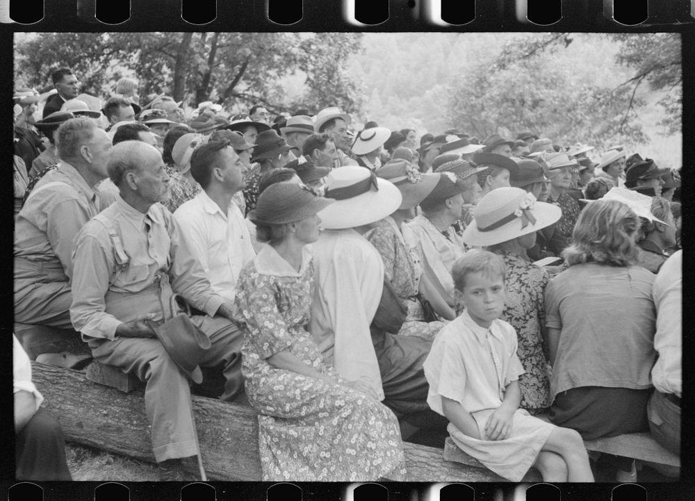 Friends of the deceased's family at an annual memorial meeting in the family cemetery. In the mountains near Jackson…