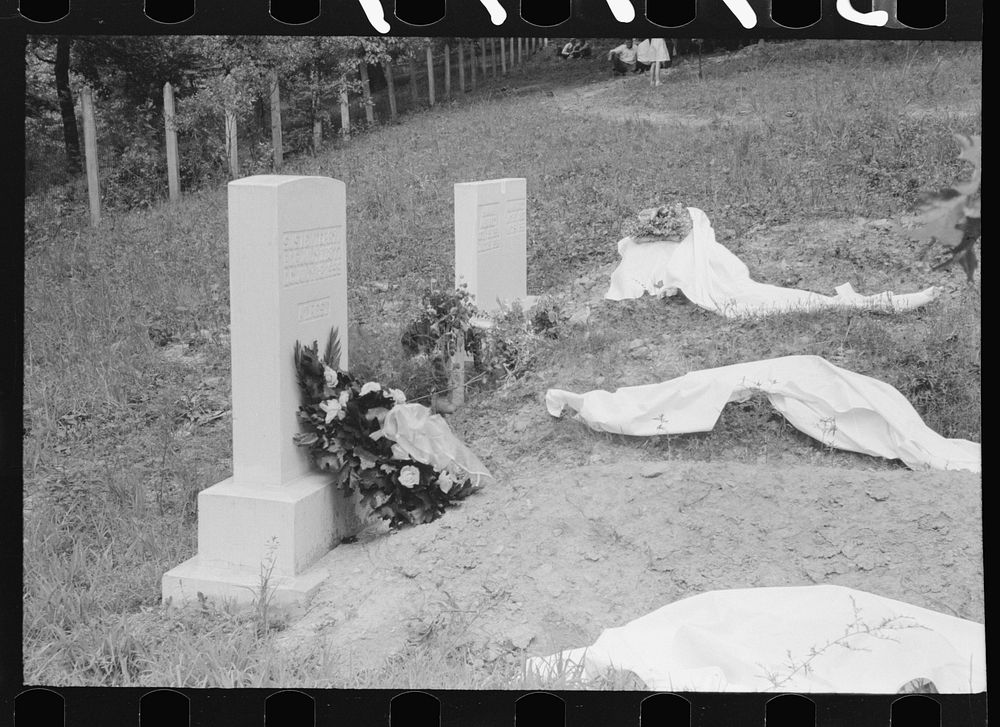 New graves decorated for an annual memorial meeting. In the mountains near Jackson, Kentucky. See general caption no. 1.…