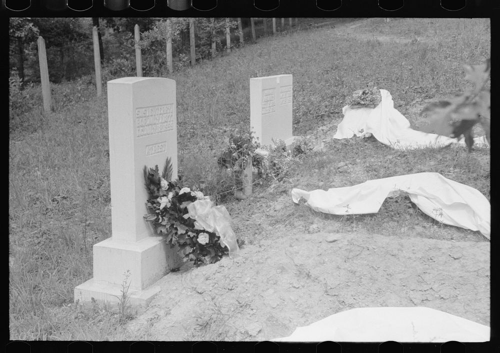 [Untitled photo, possibly related to: New graves decorated for an annual memorial meeting. In the mountains near Jackson…