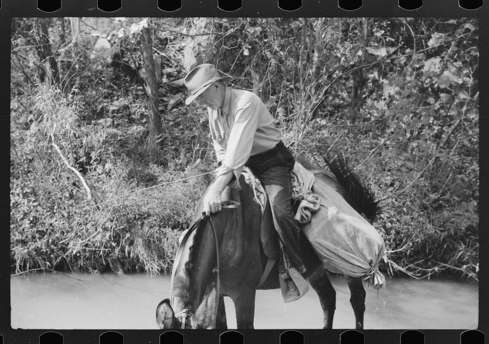 Rural mailman going up the creek bed toward Morris Fork near Jackson, Kentucky. Sourced from the Library of Congress.