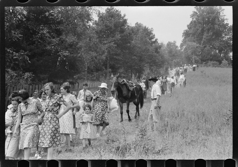 [Untitled photo, possibly related to: Relatives and friends of the family of the deceased going home from a memeorial…