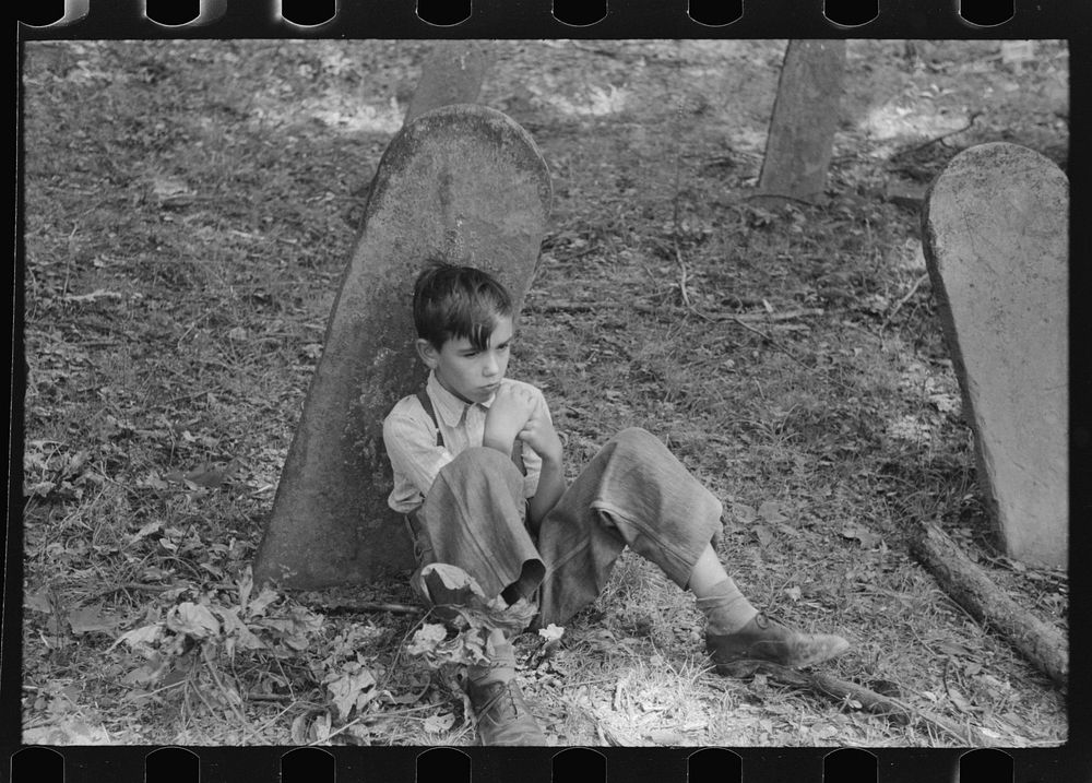 Son of one of the deceased's family at an annual memorial meeting in the family cemetery. In the mountains near Jackson…