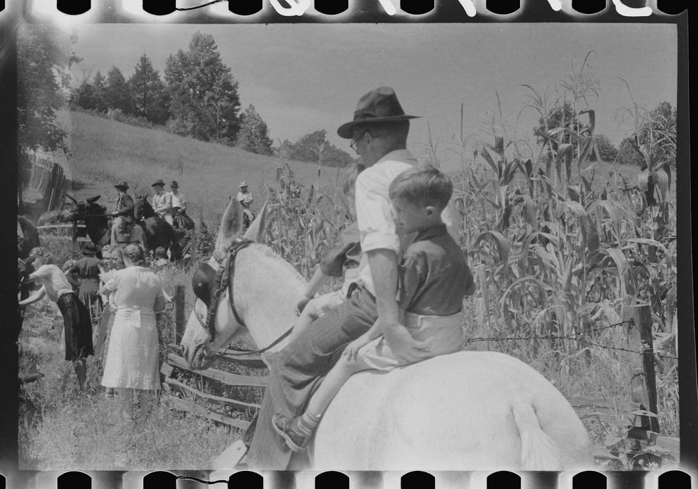 [Untitled photo, possibly related to: Relatives and friends of the family of the deceased going home from a memeorial…