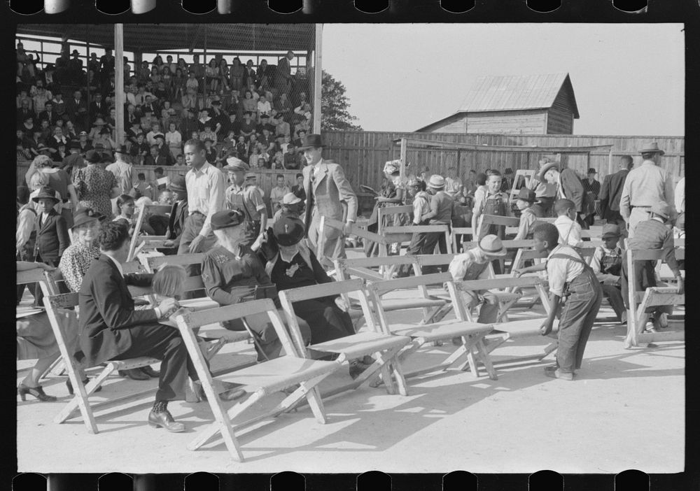 [Untitled photo, possibly related to: Yanceyville, North Carolina. Spectators listening to the county school superintendent…