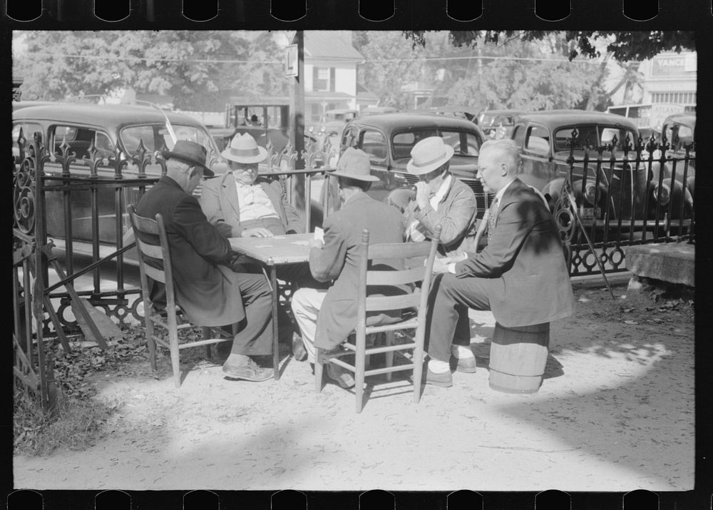 [Untitled photo, possibly related to: Members of the community playing cards in front of the courthouse, Yanceyville…