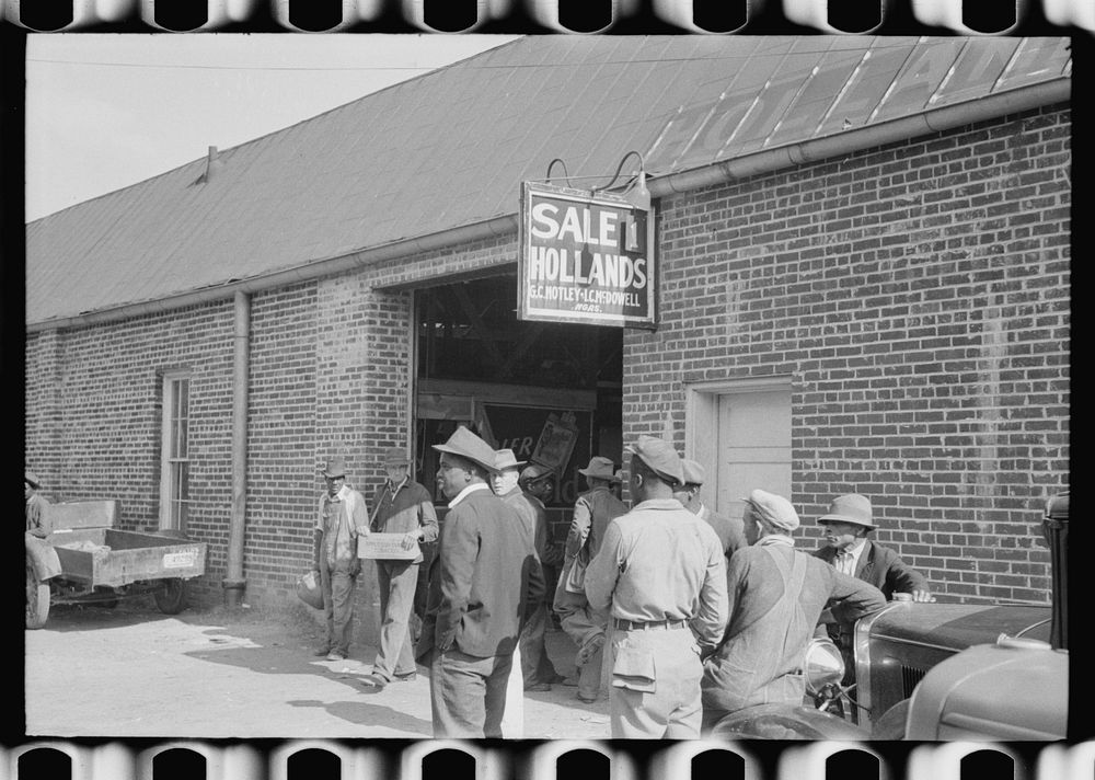 Farmers waiting outside of warehouse during tobacco auction sale. Danville, Virginia. Sourced from the Library of Congress.