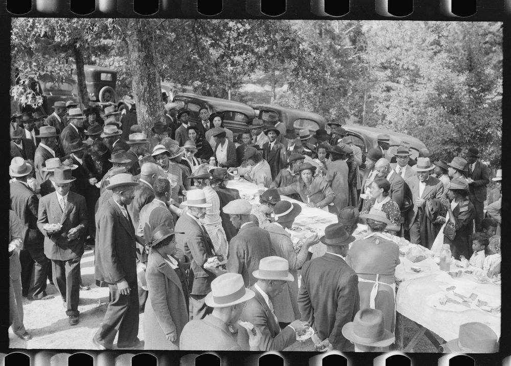 Outdoor picnic during the noon intermission of an all-day ministers and deacons meeting. Near Yanceyville, Caswell County…