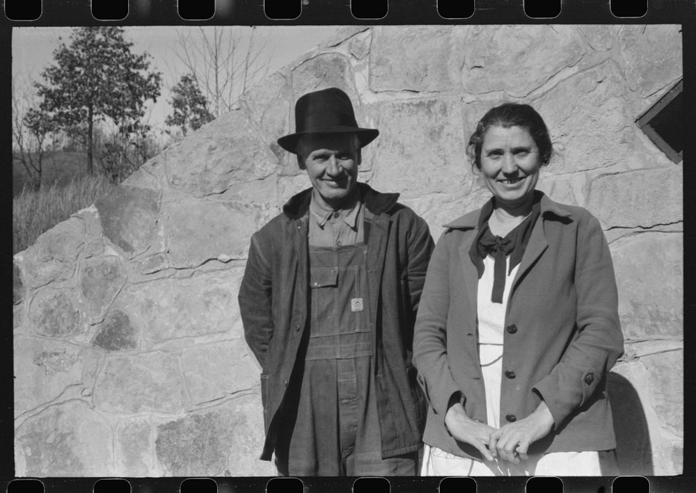 Mr. and Mrs. S. Castle or Mr. and Mrs. William S. Allen standing before their new storage house. Southern Appalachian…