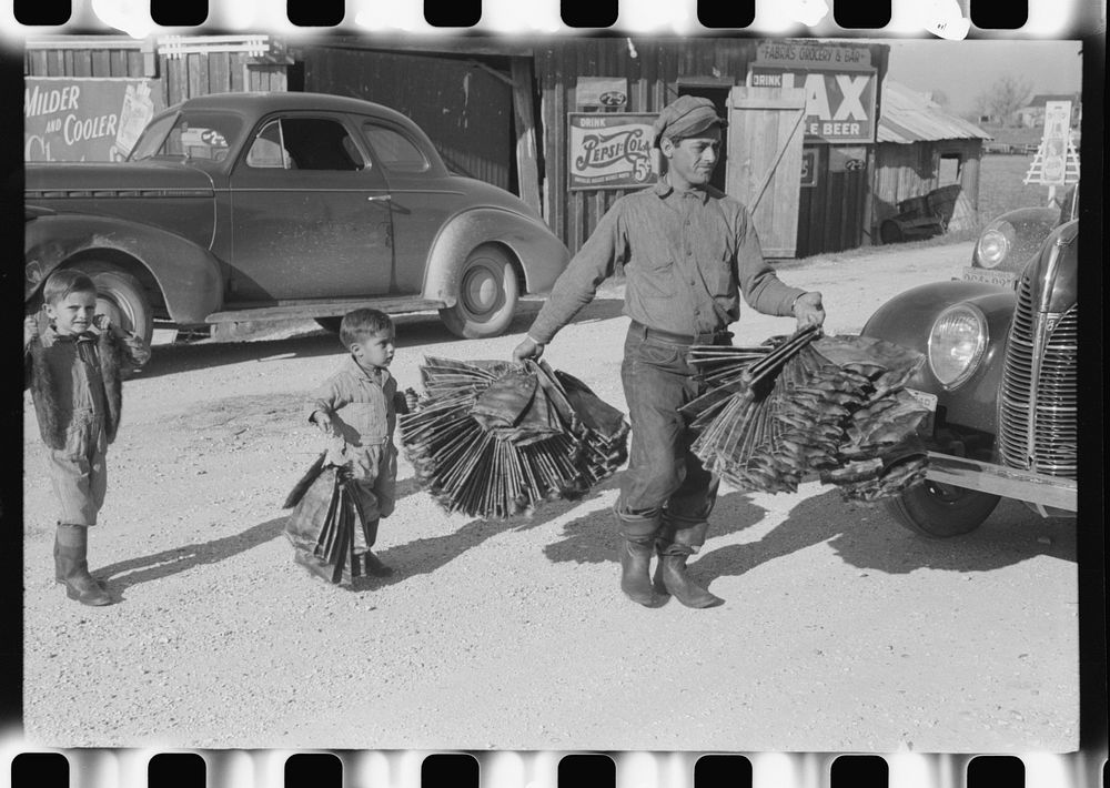 Spanish trapper and his childen taking muskrat pelts into the FSA (Farm Security Administration) auction sale which is held…