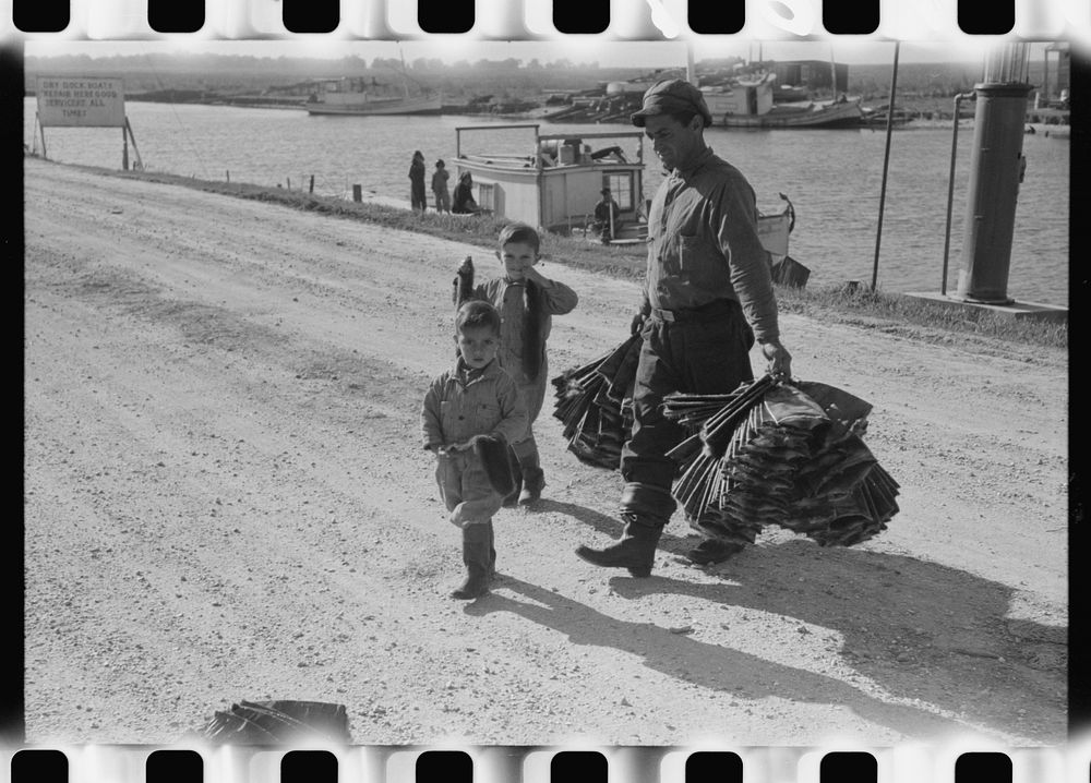 Spanish trapper and his children taking muskrat pelts into the FSA (Farm Security Administration) auction sale which is held…