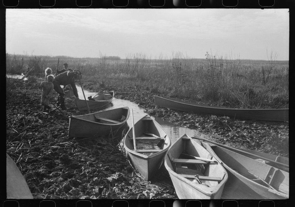 Spanish trappers returning in their home-built pirogues (canoes) in the evening after having made the rounds of their…