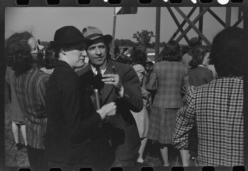 [Untitled photo, possibly related to: Bookies taking bets at horse races, Warrenton, Virginia]. Sourced from the Library of…