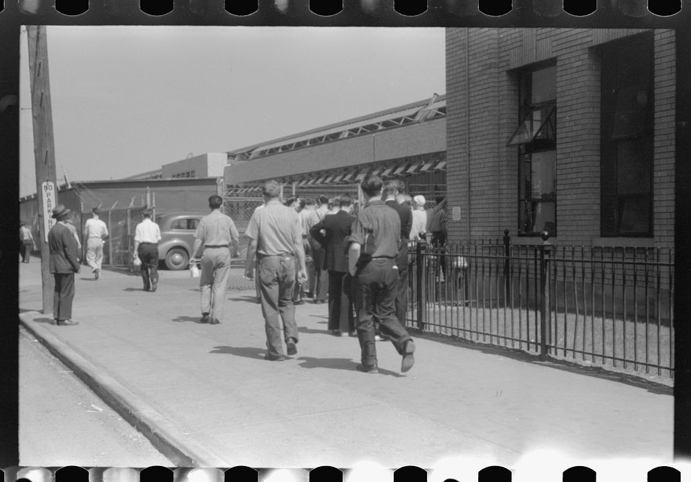 Workers entering plant at afternoon change of shift. Pratt and Whitney plant, United Aircraft, East Hartford, Connecticut.…