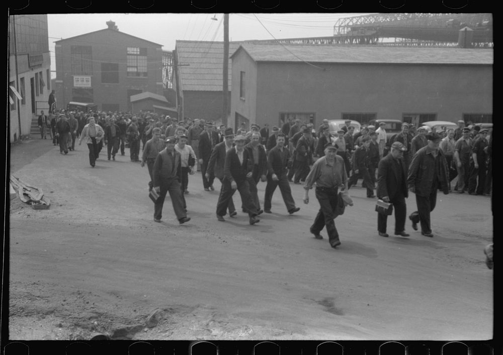 Workers leaving plant at change of shift before being paid off. Electric Boat Works, Groton, Connecticut. Sourced from the…