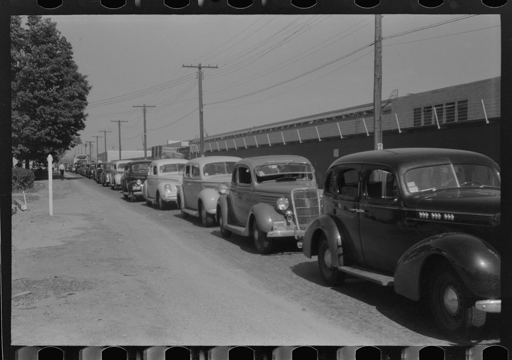 Congestion outside Pratt and Whitney United aircraft plant at afternoon change of shift. East Hartford, Connecticut. Sourced…
